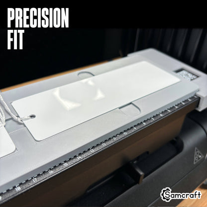 Close-up of a white metal bookmark seated in the Samcraft 2x6 jig's precision-fit recessed pocket, showing tight tolerance and alignment ruler on the eufyMake E1.