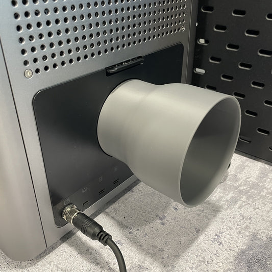 Samcraft 4 inch exhaust hose adapter fitted to the rear of an xTool F2 Ultra with ducting attached.