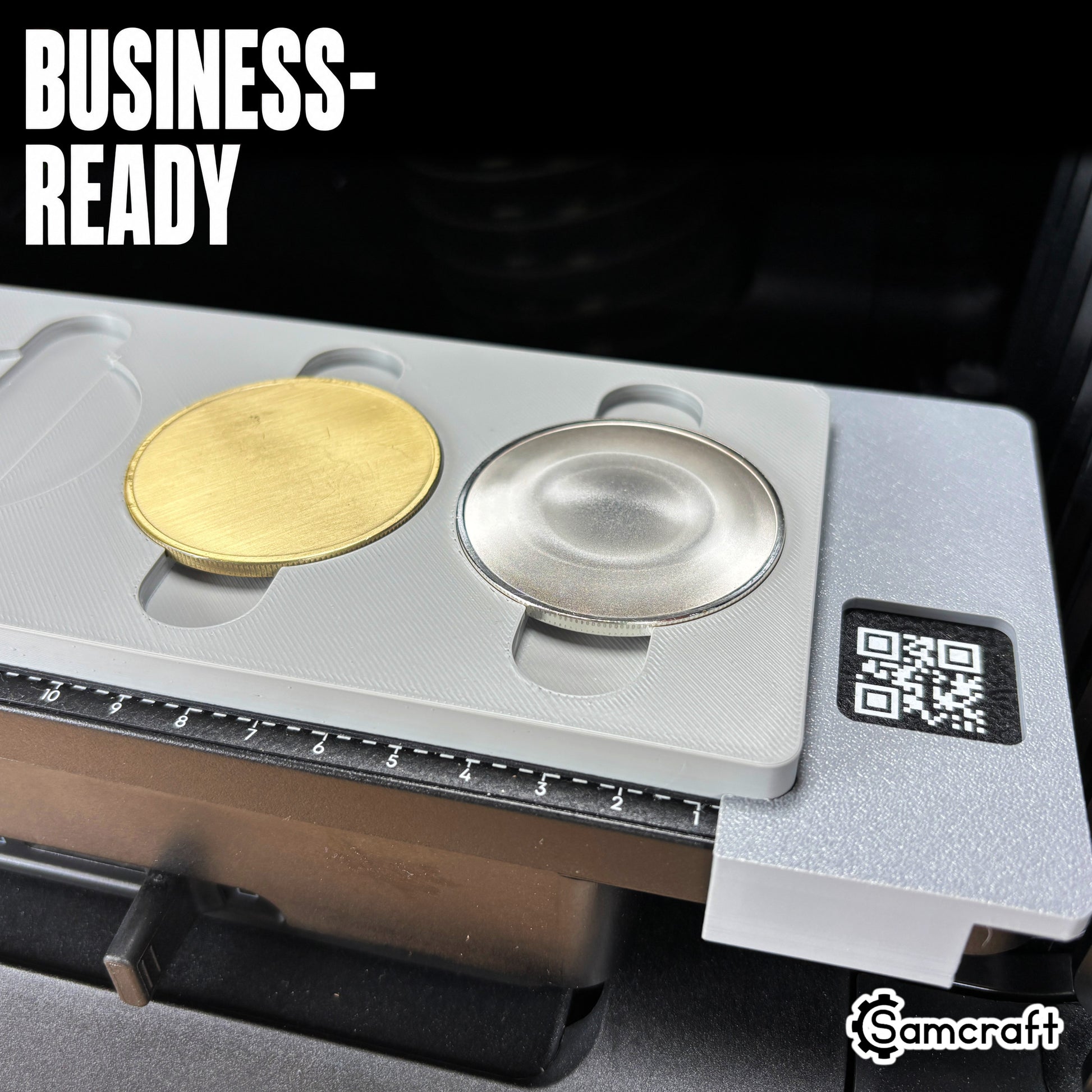 Business-ready Samcraft Metal Coin Jig holding gold and silver metal coin blanks in recessed cradles with built-in ruler on the eufyMake E1 UV printer.