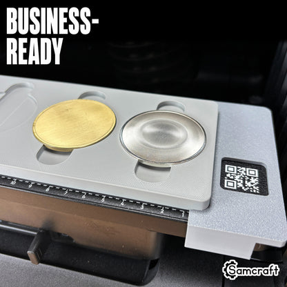 Business-ready Samcraft Metal Coin Jig holding gold and silver metal coin blanks in recessed cradles with built-in ruler on the eufyMake E1 UV printer.