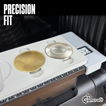 Precision-fit Samcraft Metal Coin Jig holding gold and silver metal coin blanks snugly in the gray tray's recessed cradles on the eufyMake E1.