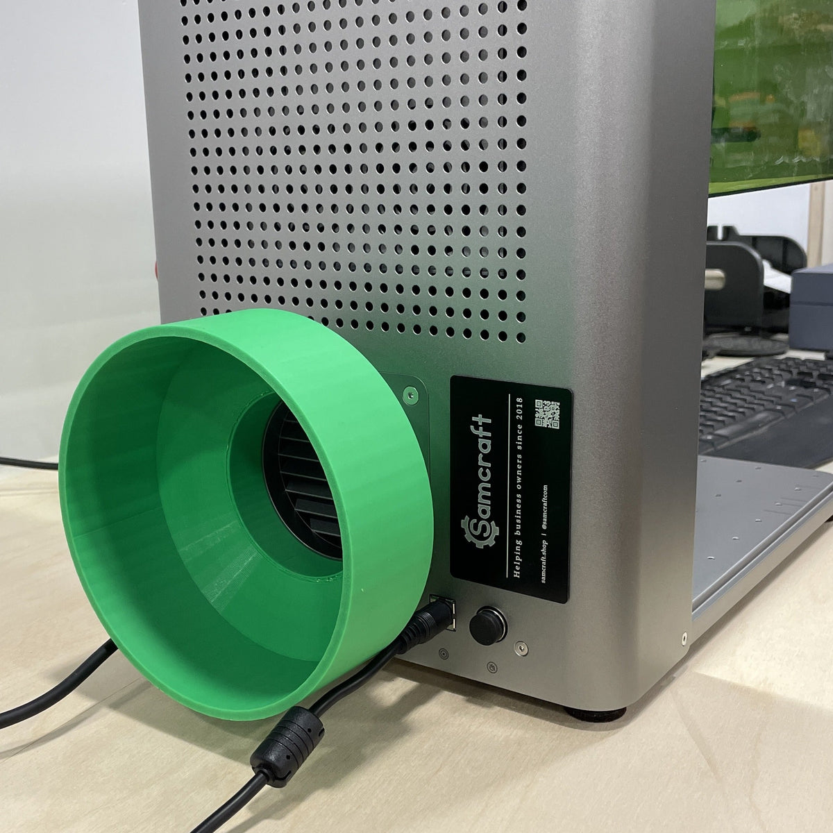 Samcraft green 6 inch exhaust hose adapter fitted to the rear of an xTool F1 Ultra.