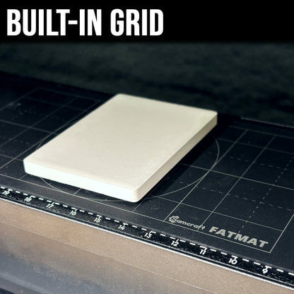 Close-up of the FatMat's built-in grid with a cream blank positioned on it for alignment
