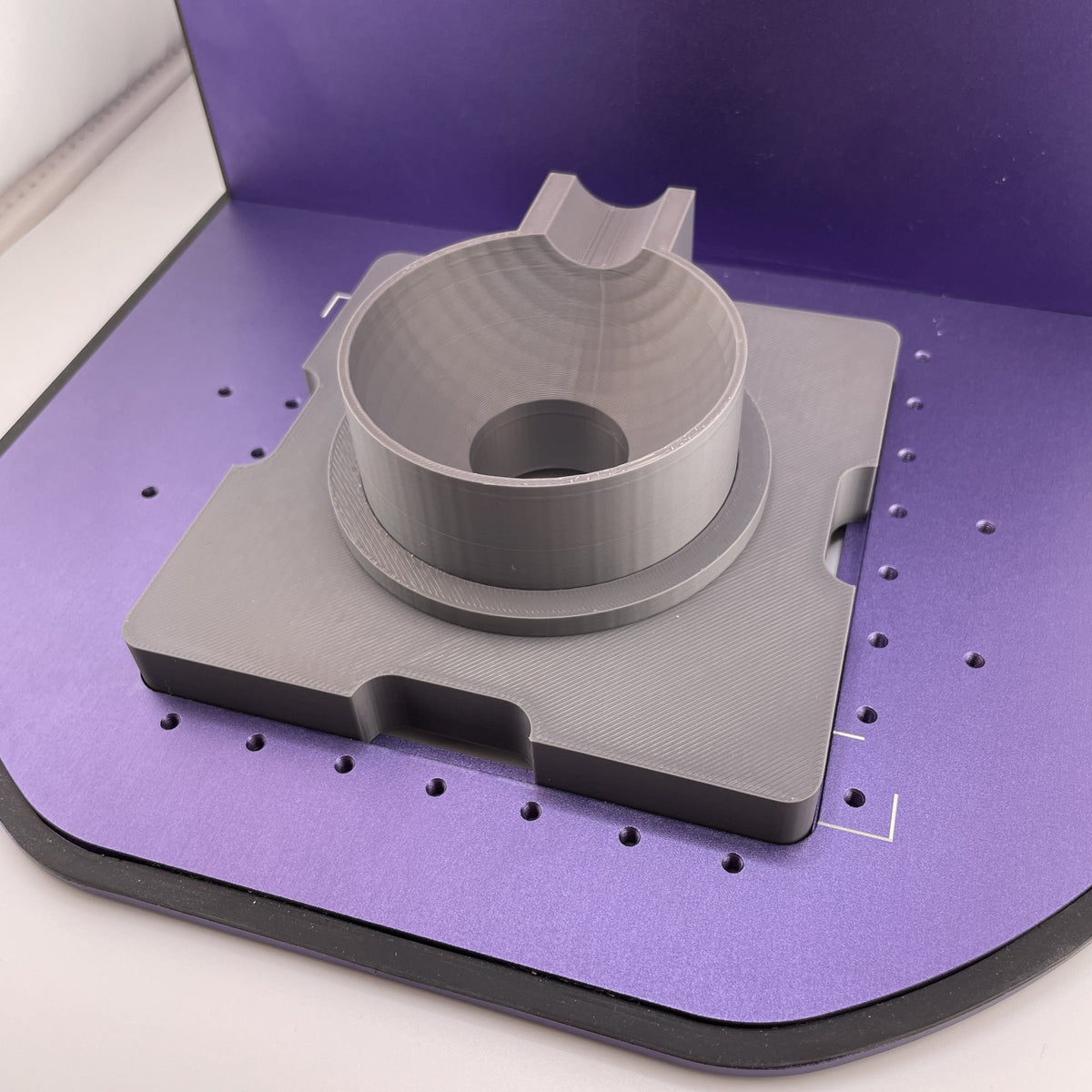 Samcraft ball ornament jig on the purple bed of a WeCreat Lumos, showing the centre holder and size-stepped rings.