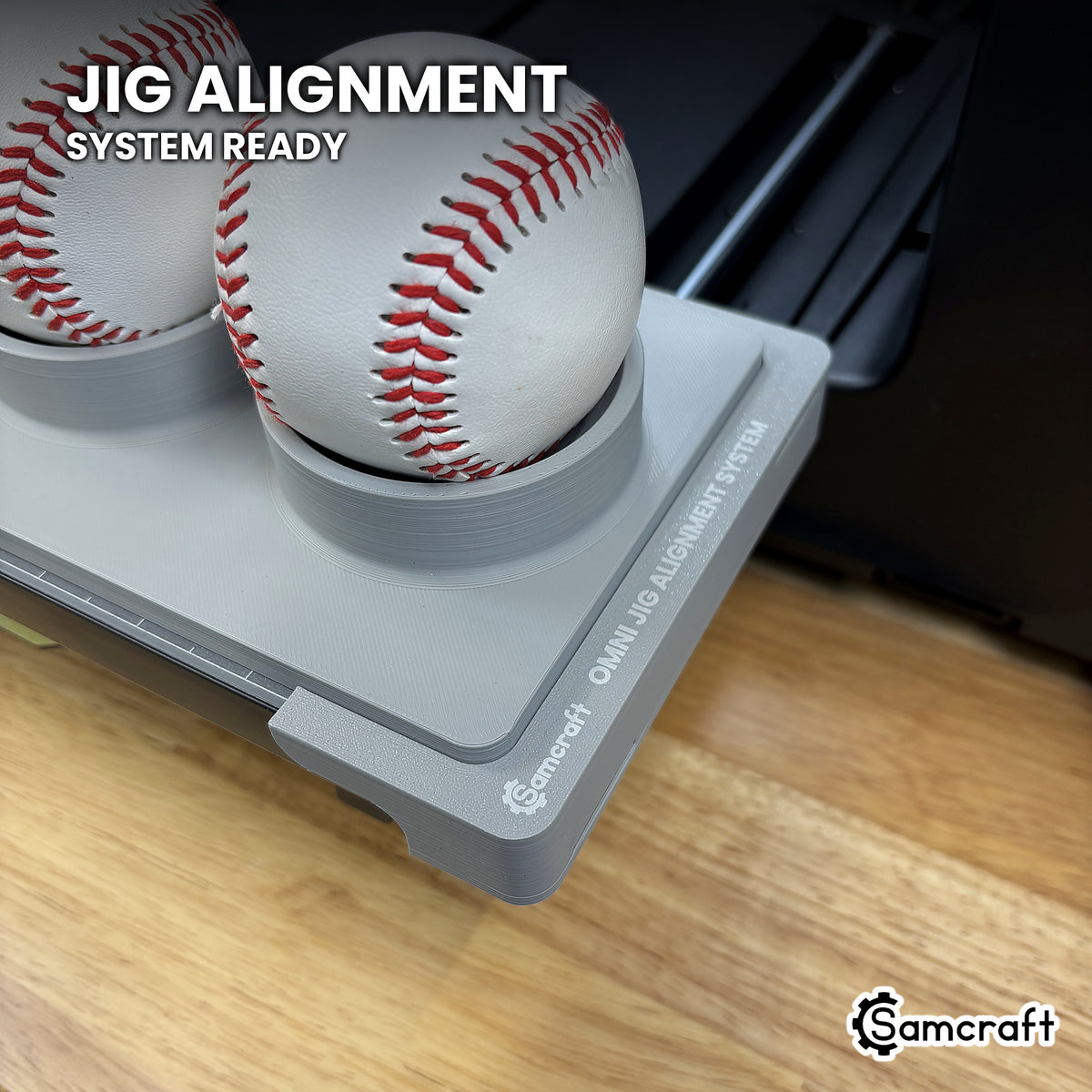 Close-up of the Samcraft baseball jig seated on the Omni Jig Alignment System, the alignment system lettering visible along the edge.