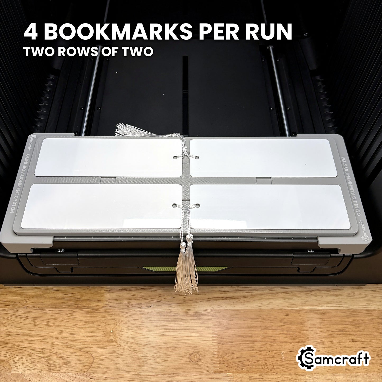 Samcraft bookmark jig for the xTool Omni holding four 2x6 bookmarks in two rows of two, a full tray printed in one job.