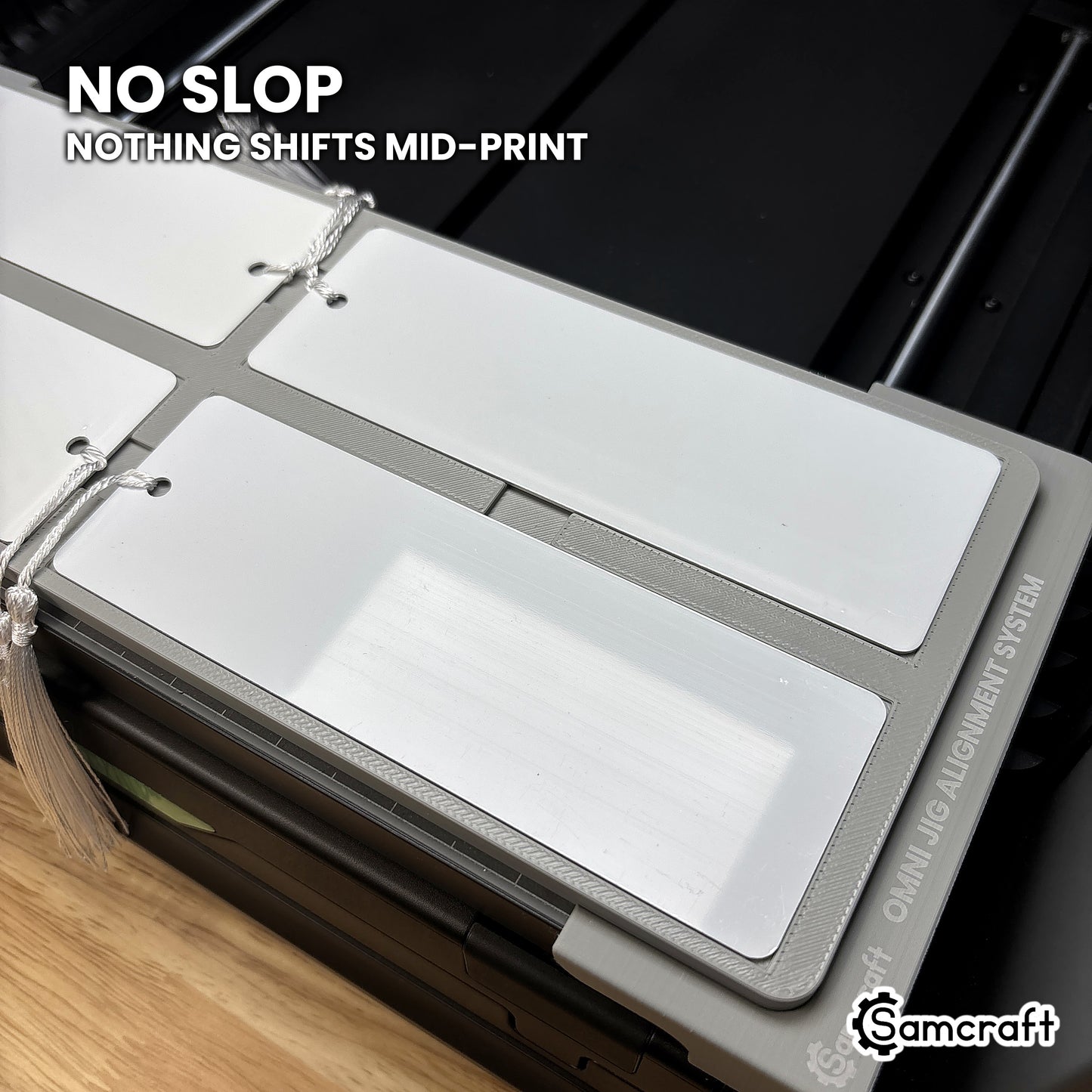 Bookmark seated tight in the Samcraft xTool Omni jig pocket with no slop, so nothing shifts mid-print.