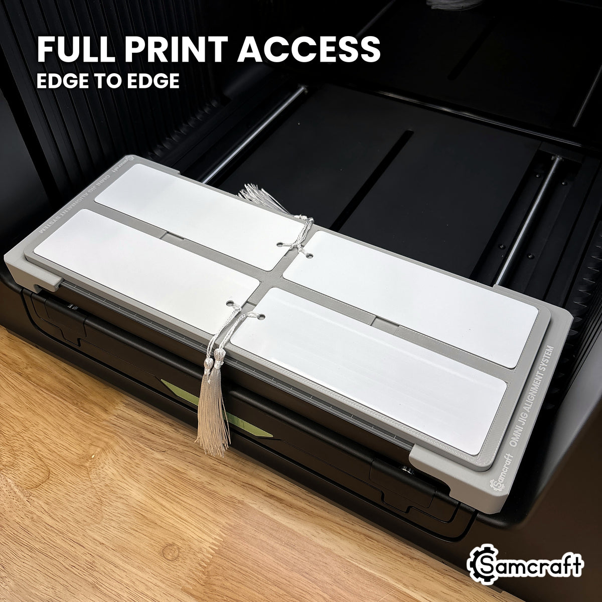 Bookmarks in the Samcraft xTool Omni jig with the full face exposed, giving edge to edge print access.