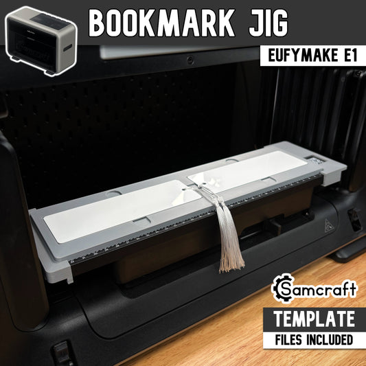 Main product image of the Samcraft 2x6 Bookmark Jig for the eufyMake E1 UV printer, showing white metal bookmarks with a tassel in a gray tray; template files included.