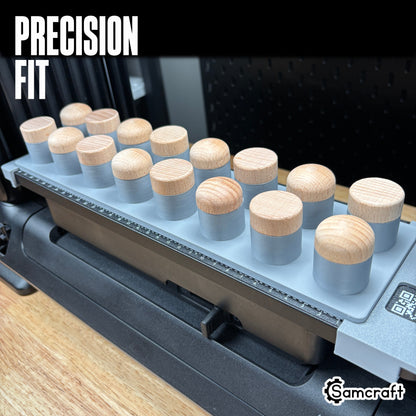 Precision-fit Samcraft Bottle Stopper Jig holding wood-topped bottle stoppers snugly in gray cylindrical recesses on the eufyMake E1 UV printer.