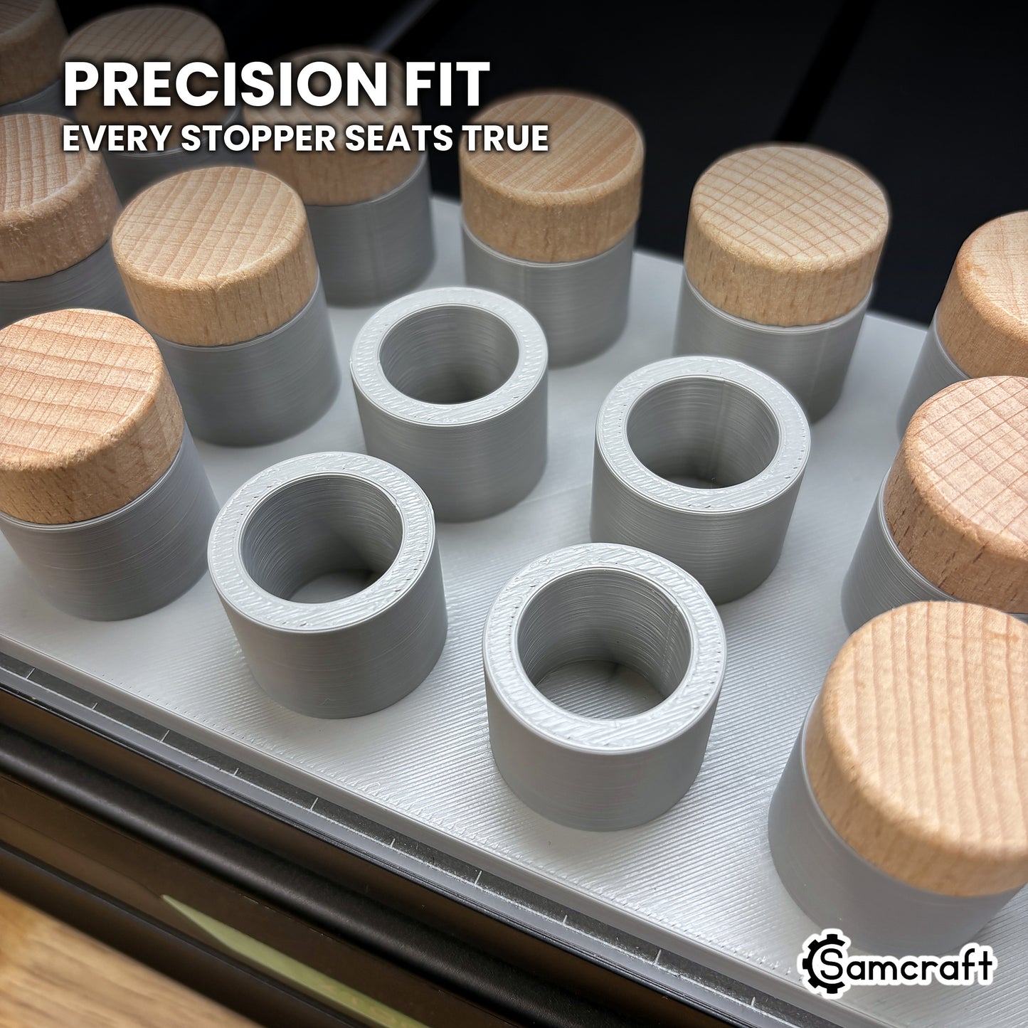 Close-up of the empty rings in the Samcraft xTool Omni bottle stopper jig, each sized so a stopper stands true.