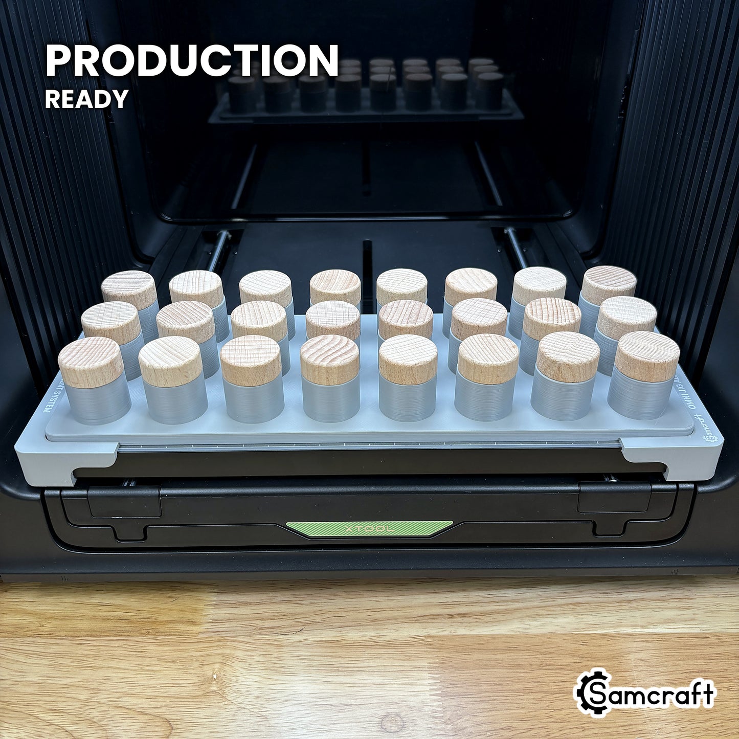 Samcraft bottle stopper jig loaded with twenty-four stoppers on the xTool Omni UV printer bed, set up for production runs.