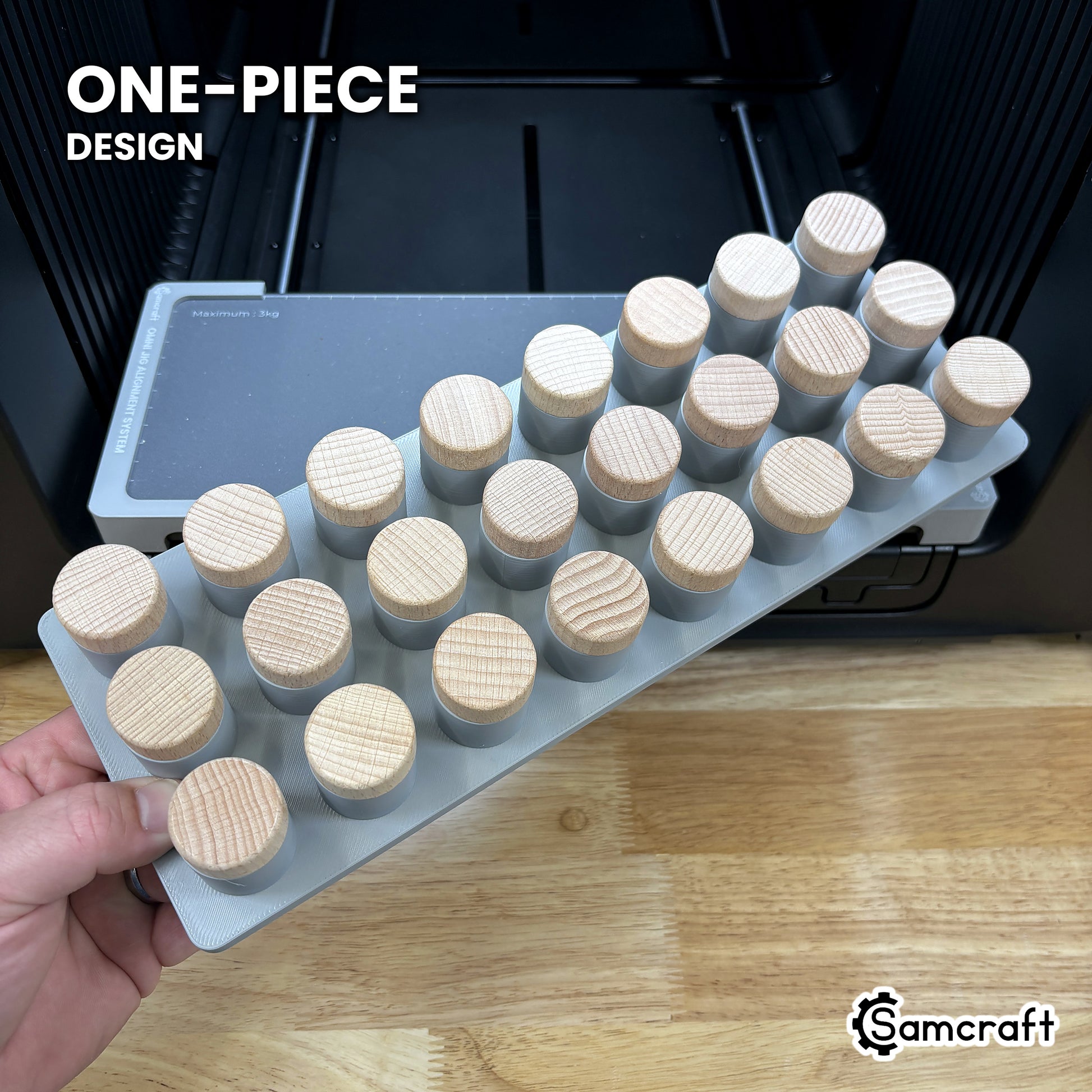 The one-piece Samcraft bottle stopper jig for the xTool Omni, twenty-four stoppers standing in a single molded tray.