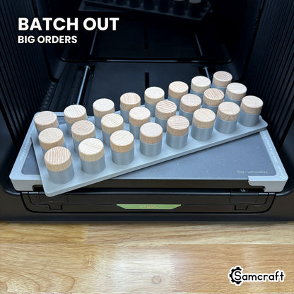 Samcraft xTool Omni bottle stopper jig filled with twenty-four stoppers, ready for wedding favor and wine club batch runs.