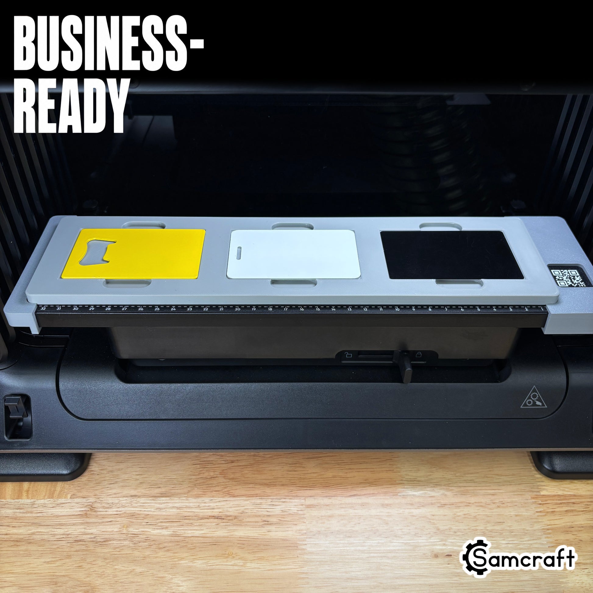 Samcraft Business Card Jig on the eufyMake E1 bed loaded with a yellow bottle-opener card, a white card and a black metal card