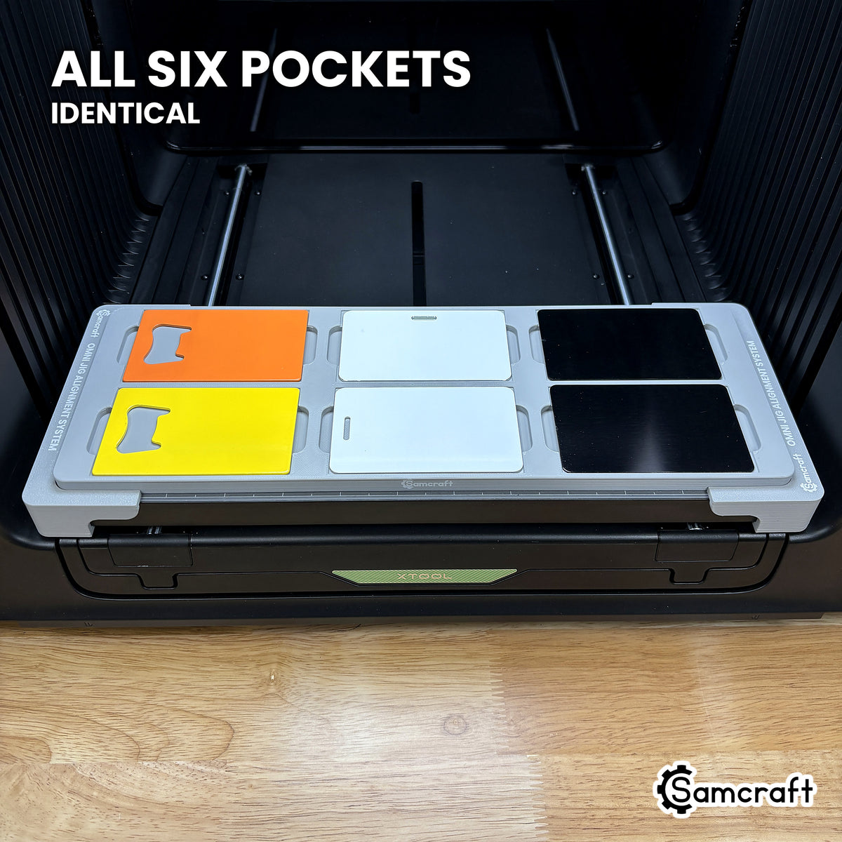 Straight-on view of the Samcraft xTool Omni card jig, all six pockets identically oriented so one artwork file covers the whole bed.