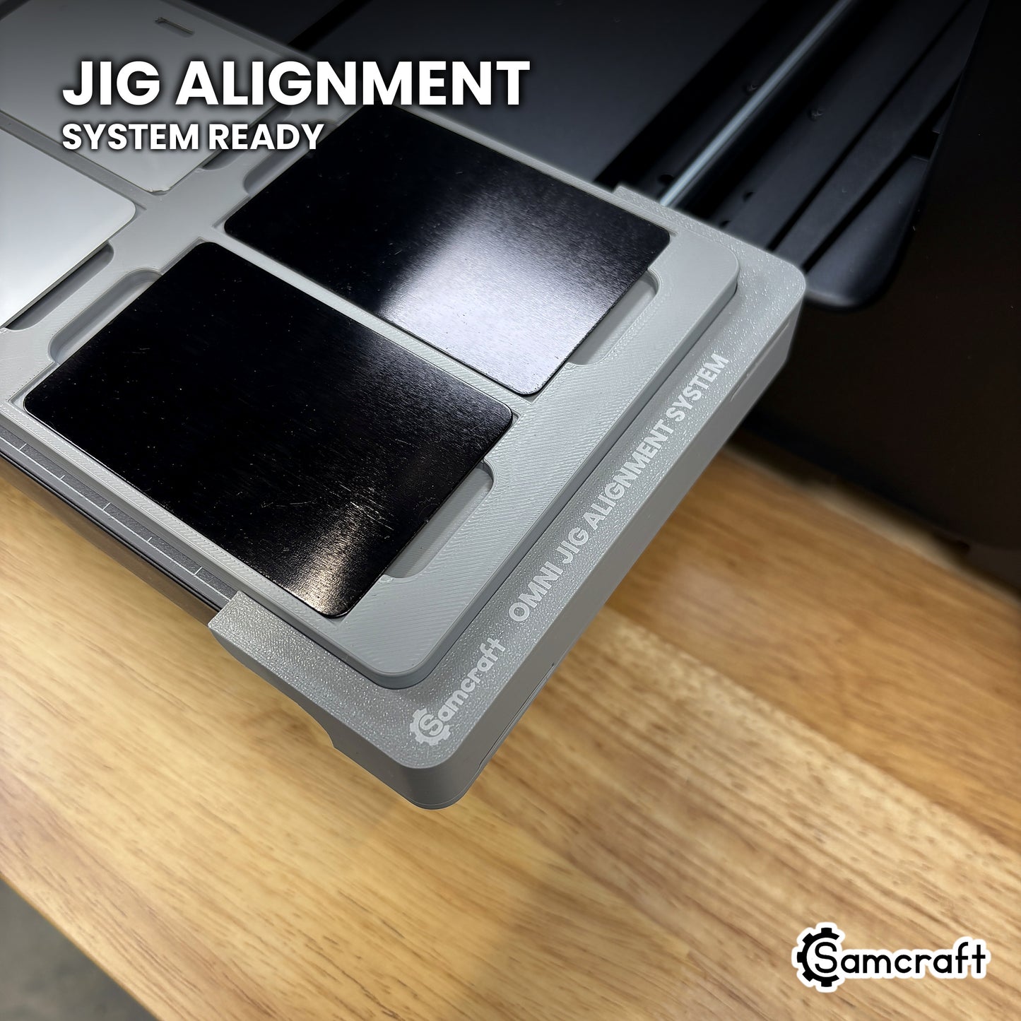 Samcraft card jig seated on the optional Samcraft Omni Jig Alignment System, the alignment system lettering visible along the edge.