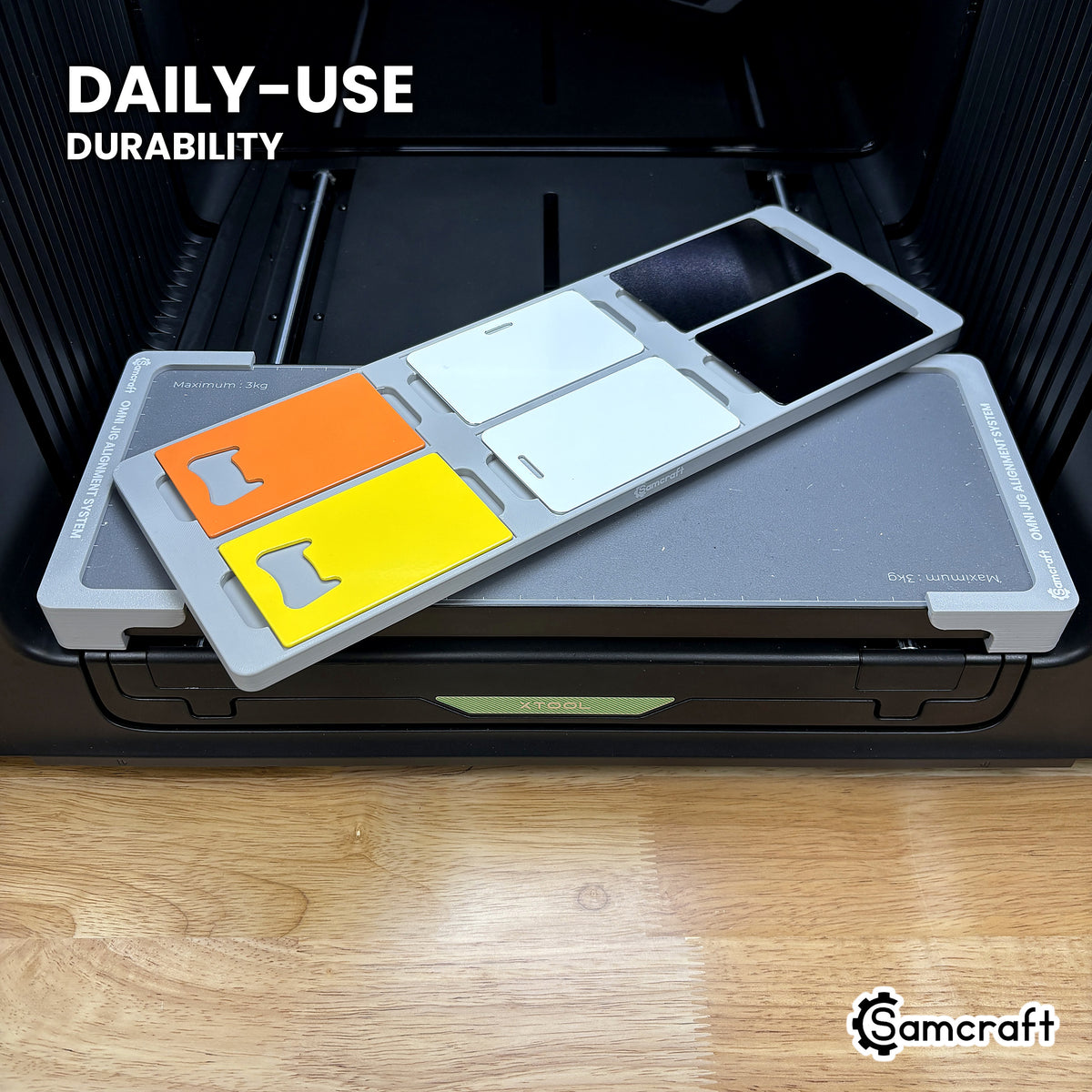 Samcraft card jig in high-temperature rated plastic holding six card blanks on the xTool Omni bed, built for daily-use durability.