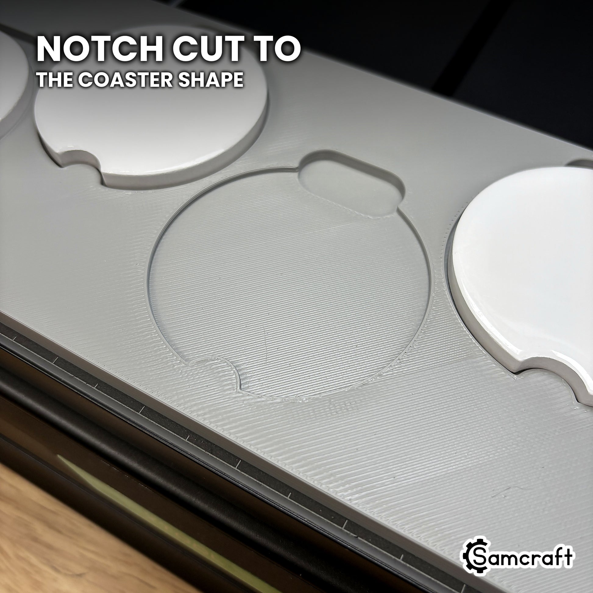Empty pocket in the Samcraft xTool Omni car coaster jig, cut to the coaster's notched outline so the blank seats one way.