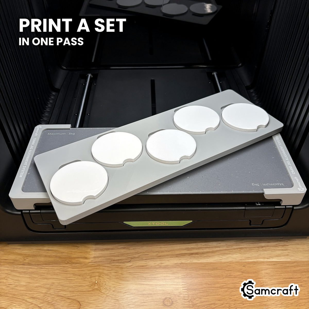 Samcraft xTool Omni car coaster jig filled with five coasters, enough to print two matched pairs and a spare in one pass.