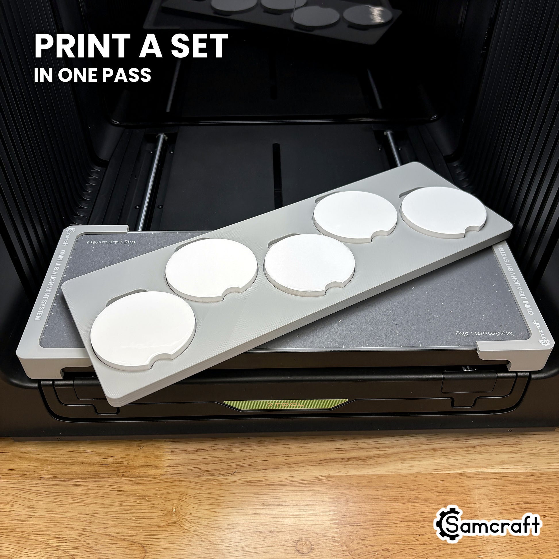 Samcraft xTool Omni car coaster jig filled with five coasters, enough to print two matched pairs and a spare in one pass.