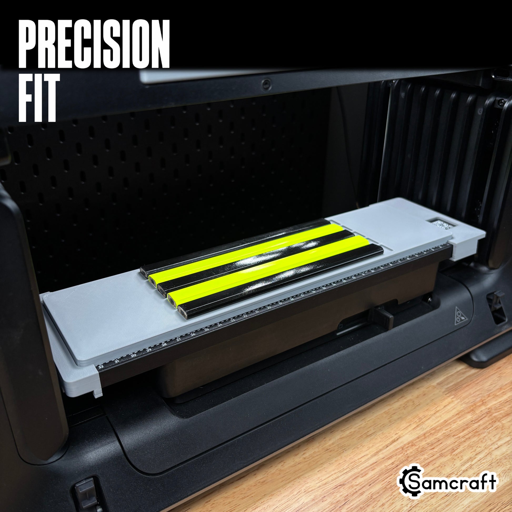 Samcraft Carpenter Pencil Jig holding five black and neon yellow flat carpenter pencils in a one-piece gray 3D-printed tray with built-in alignment ruler on the eufyMake E1 UV printer.