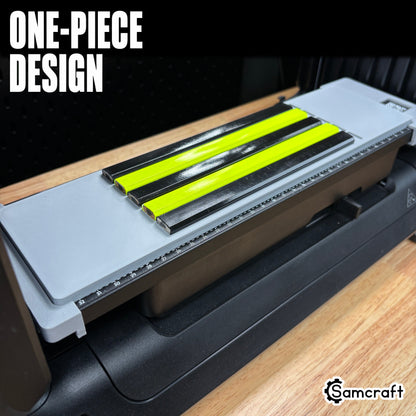 Angled view of the one-piece Samcraft Carpenter Pencil Jig loaded with black and neon yellow carpenter pencils on the eufyMake E1 UV printer bed.