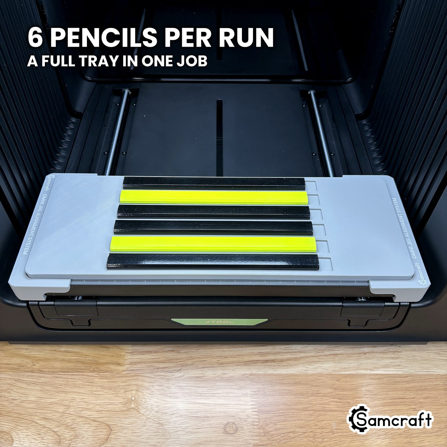Samcraft carpenter pencil jig on the xTool Omni print bed loaded with six carpenter pencils, a full tray ready to run in one job.