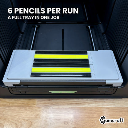 Samcraft carpenter pencil jig on the xTool Omni print bed loaded with six carpenter pencils, a full tray ready to run in one job.