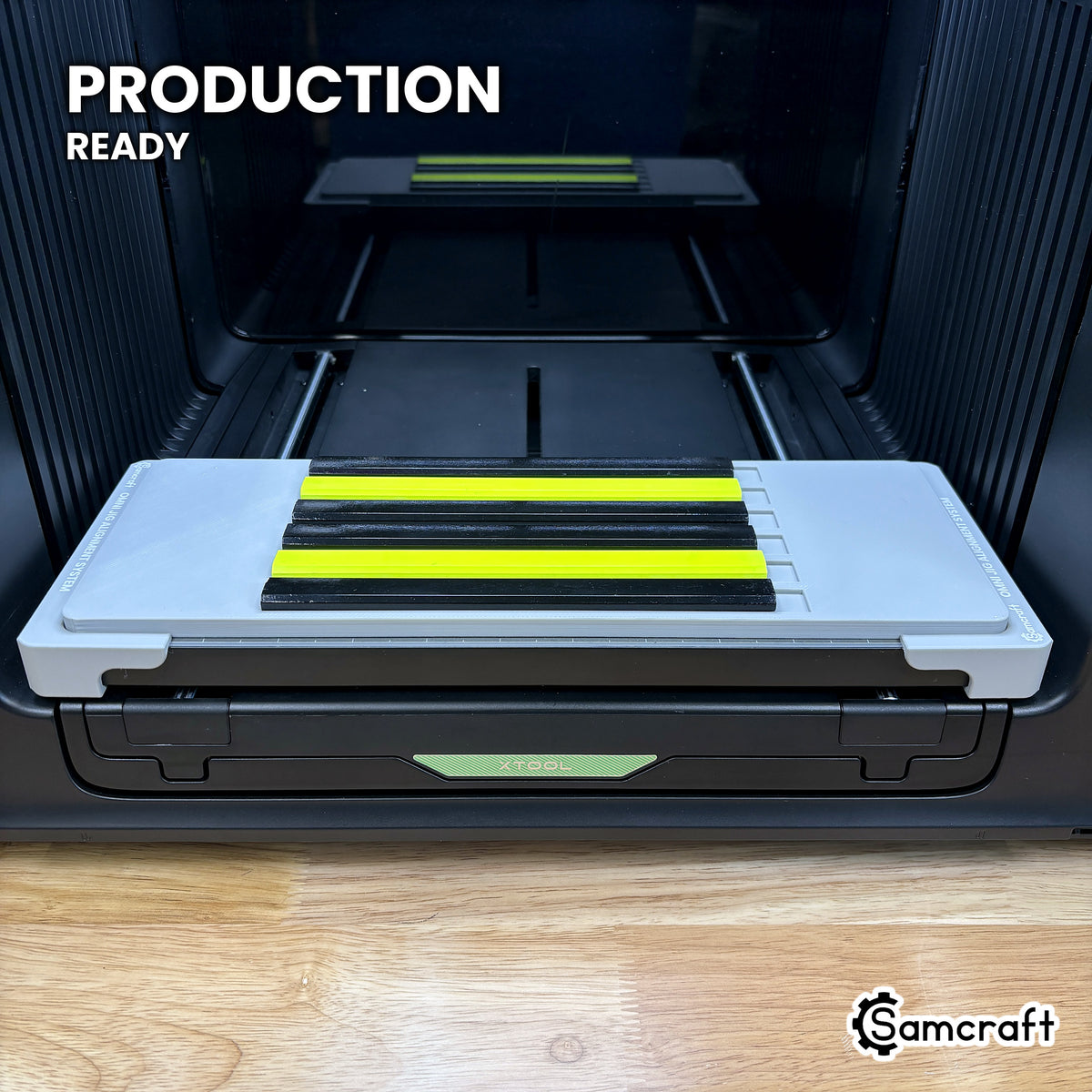 Samcraft carpenter pencil jig centered on the xTool Omni UV printer bed with six pencils loaded, set up for production runs.
