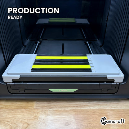 Samcraft carpenter pencil jig centered on the xTool Omni UV printer bed with six pencils loaded, set up for production runs.