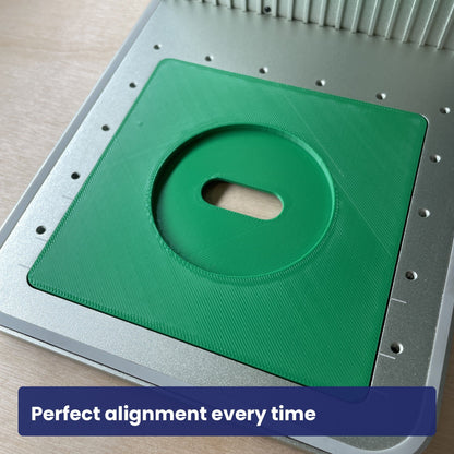 Empty Samcraft compact mirror jig in the xTool F1 bed, showing the circular recess and finger cut-out.