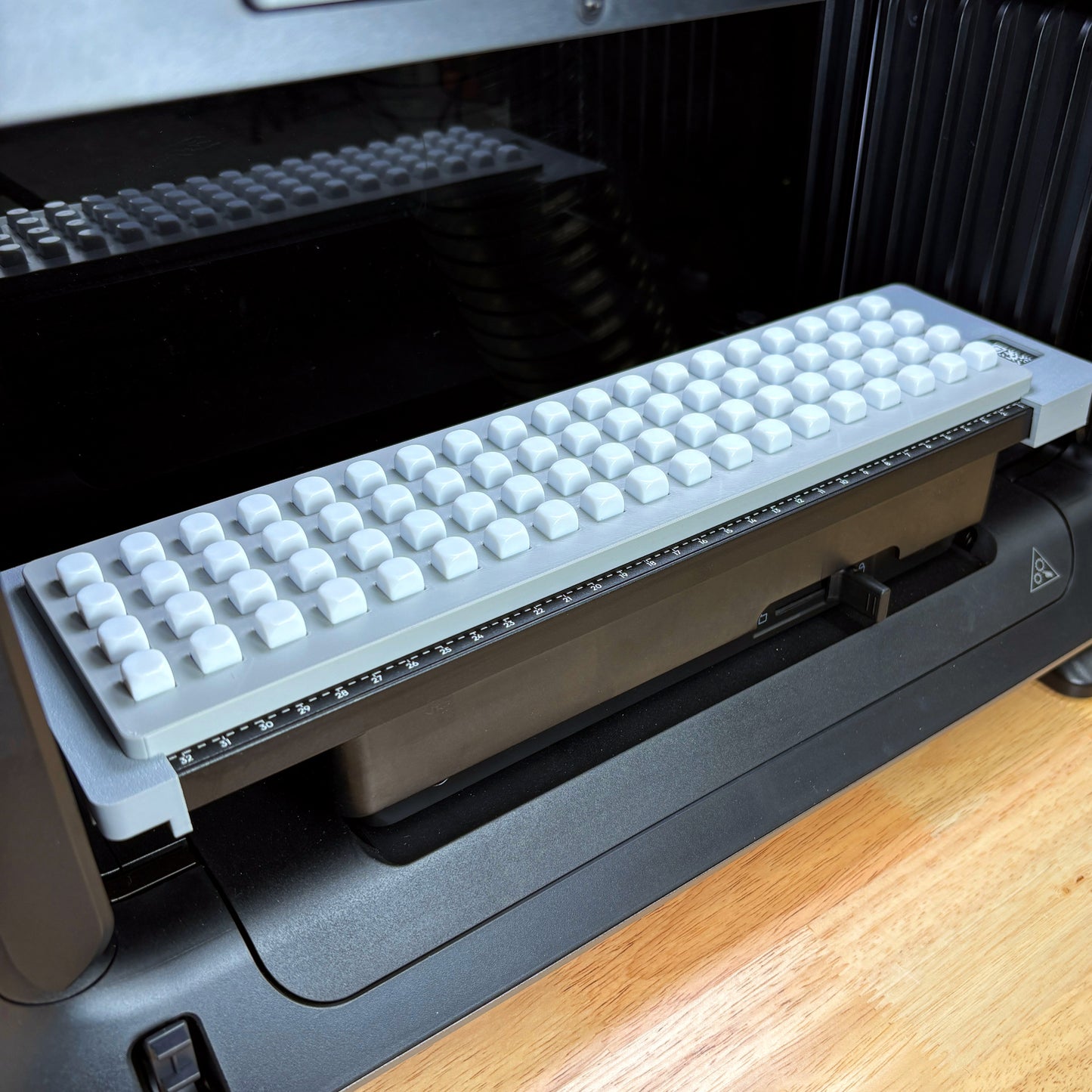 Samcraft 10mm Dice Jig fully loaded with white 10mm dice on the eufyMake E1 UV printer bed