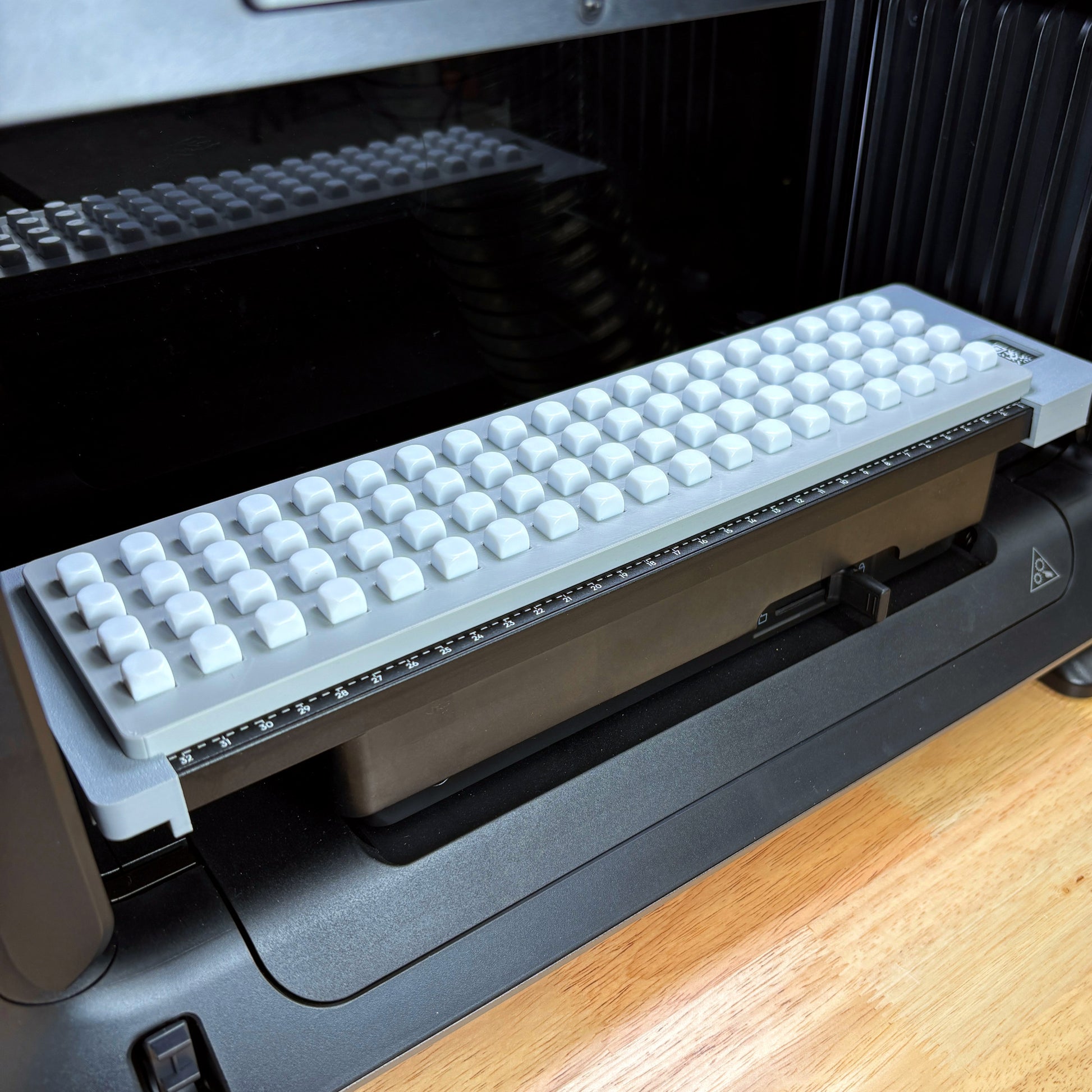 Samcraft 10mm Dice Jig fully loaded with white 10mm dice on the eufyMake E1 UV printer bed