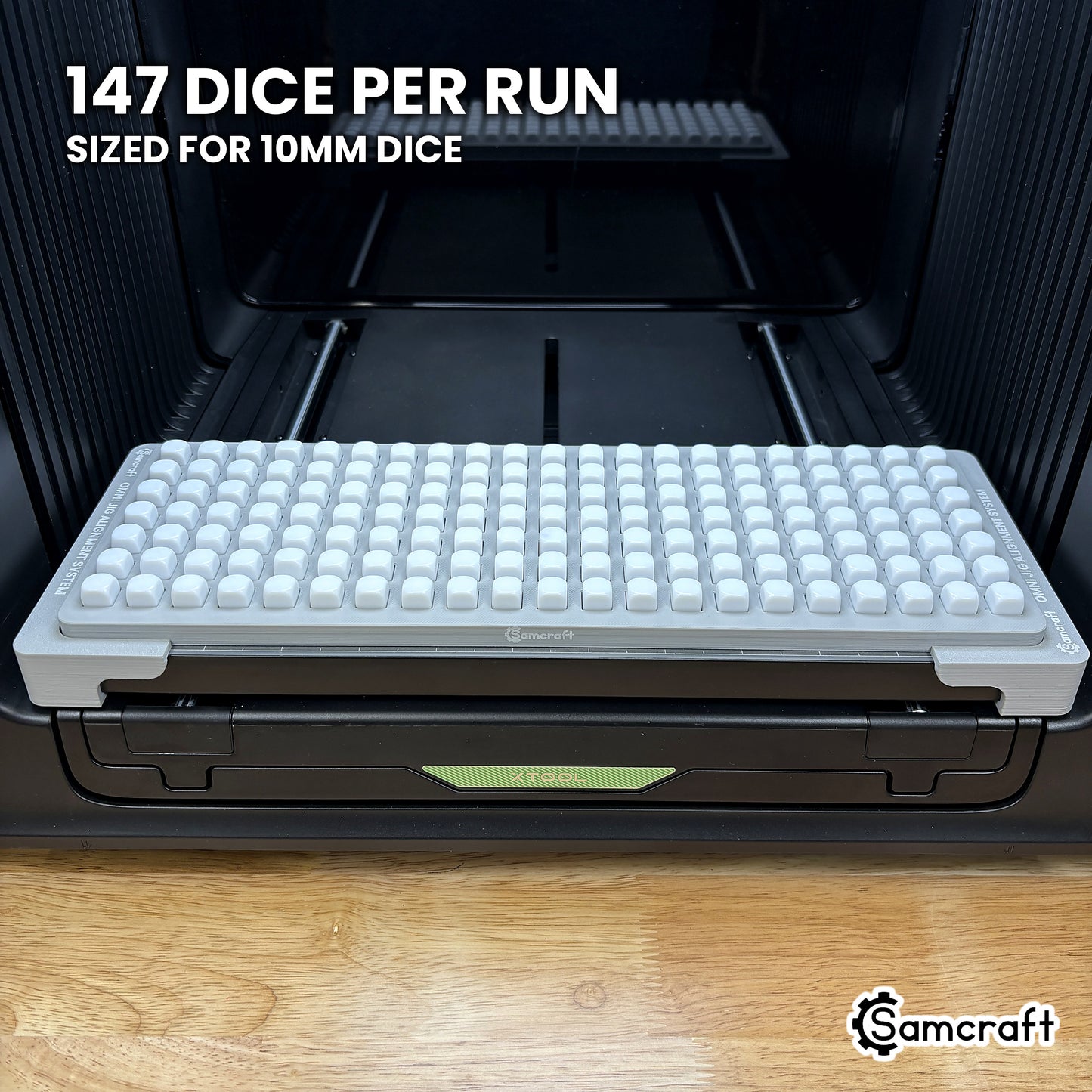 Samcraft 10mm dice jig loaded with 147 blank dice in twenty-one columns of seven, a full production run in a single pass on the xTool Omni.