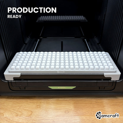 Samcraft 10mm dice jig holding 147 blank dice on the xTool Omni UV printer bed, set up for production runs.