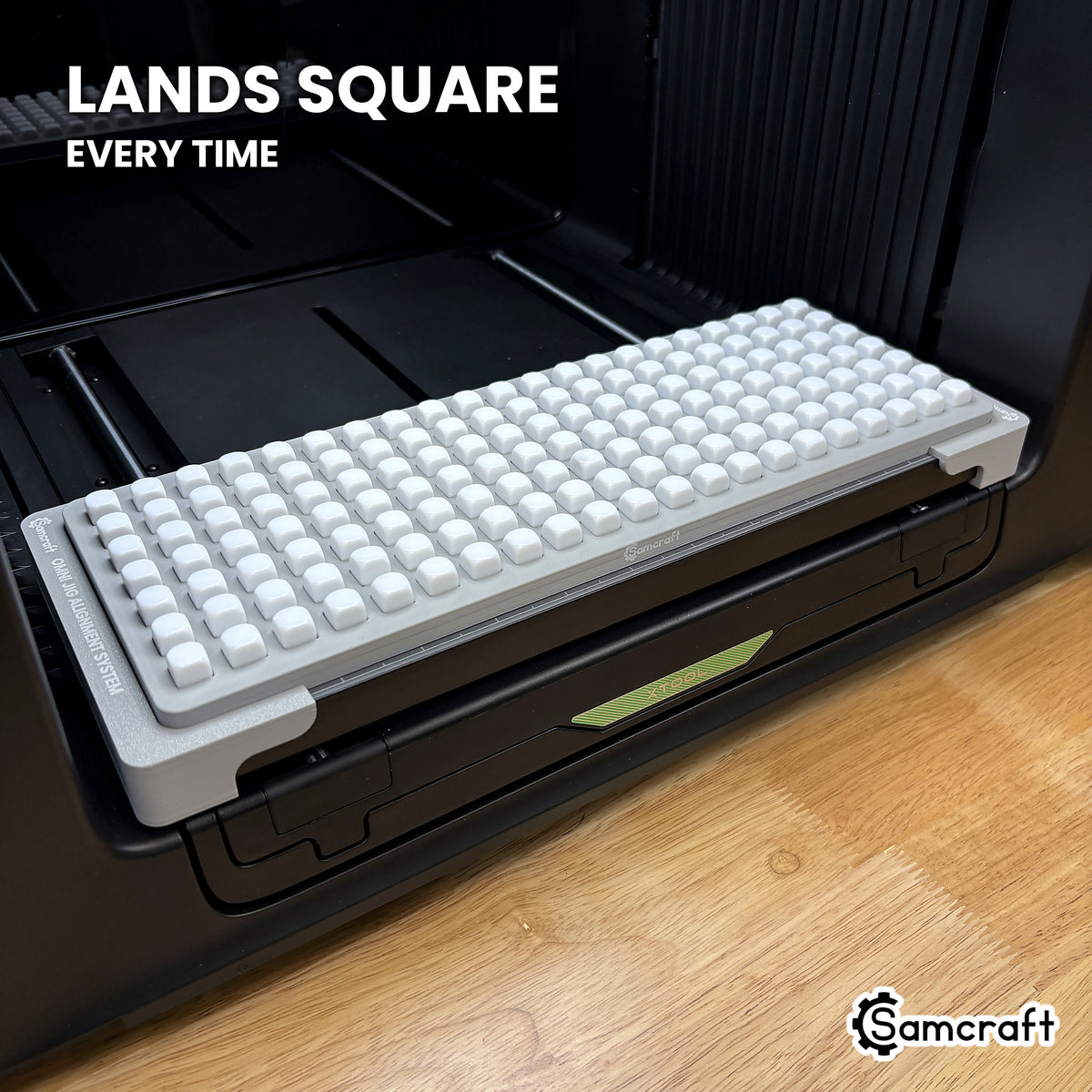 Samcraft 10mm dice jig seated square on the xTool Omni printer bed, every pocket aligned to the same orientation.