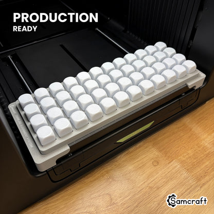 Samcraft 22mm dice jig holding 48 blank dice on the xTool Omni UV printer bed, set up for production runs.