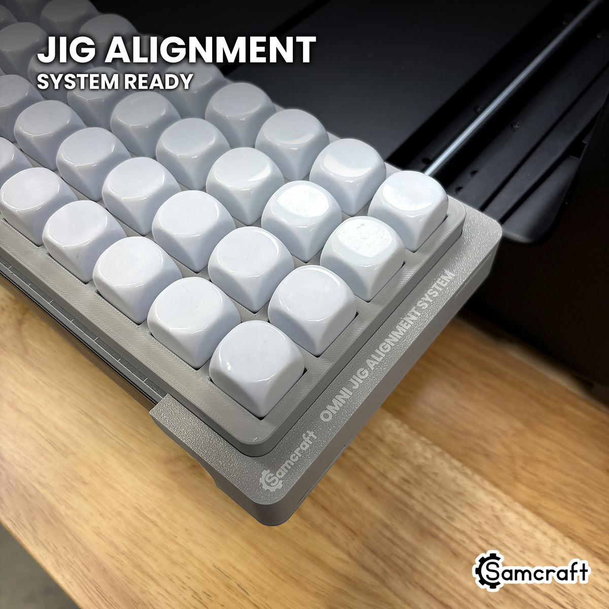 Close-up of the Samcraft 22mm dice jig seated on the Omni Jig Alignment System, the alignment system lettering visible along the edge.