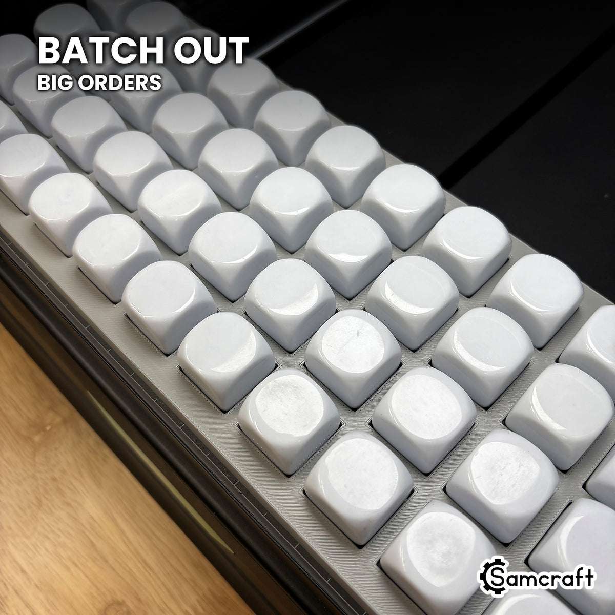 Tight view across the Samcraft 22mm dice jig packed with blank dice, showing the batch volume a single run covers.