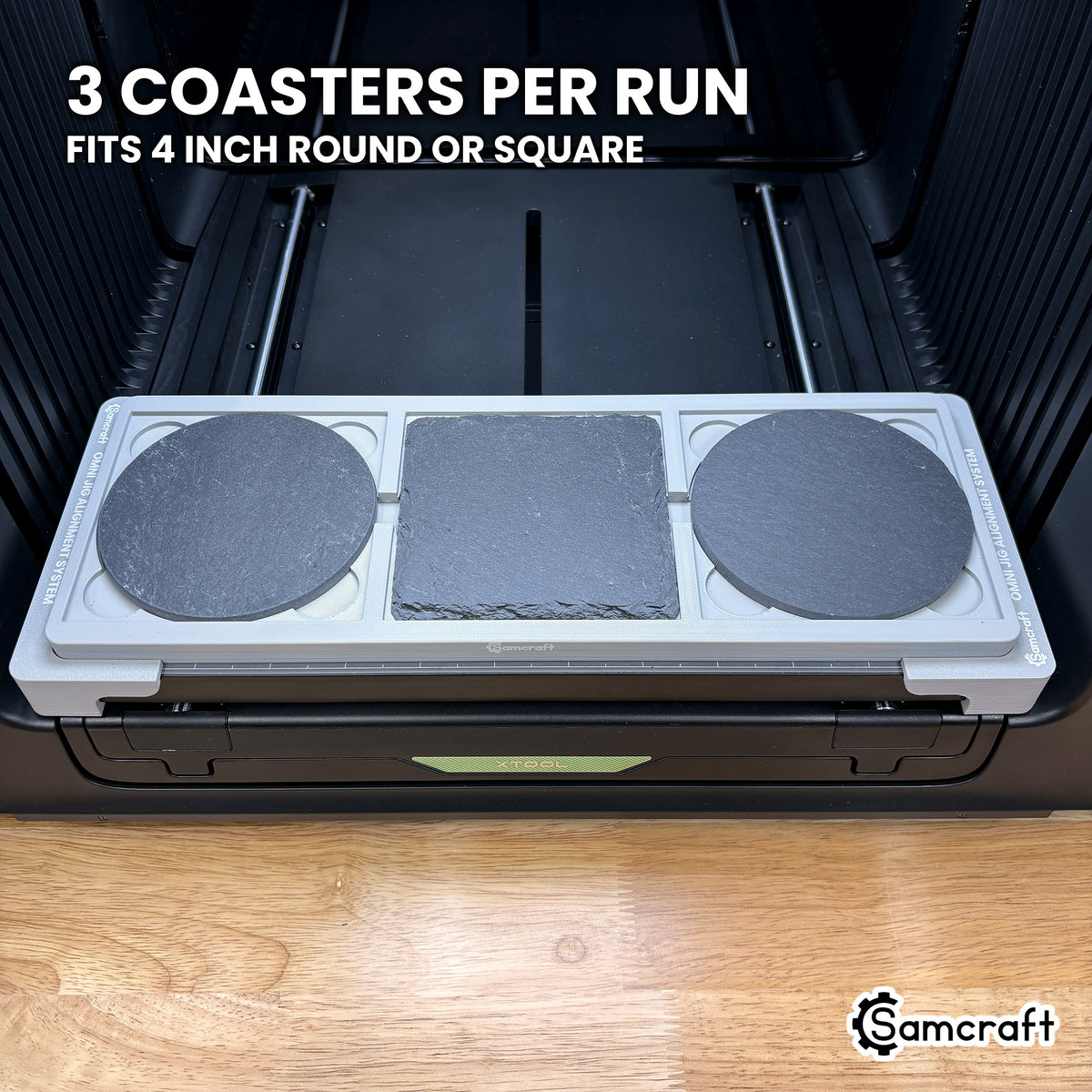 Samcraft coaster jig for the xTool Omni loaded with three 4 inch slate coasters, round and square in the same jig.