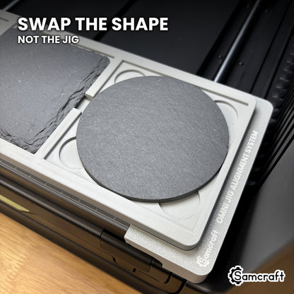 A round slate coaster seated in the same Samcraft xTool Omni pocket that takes a square coaster, showing the shape swaps without changing jigs.