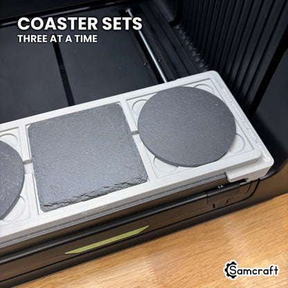 Samcraft xTool Omni 4 inch coaster jig filled with three slate coasters, ready to print a mixed round and square coaster set.