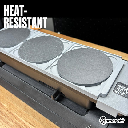 Heat-resistant Samcraft 4-inch Drink Coaster Jig holding round slate coasters in recessed pockets with built-in ruler on the eufyMake E1 UV printer.