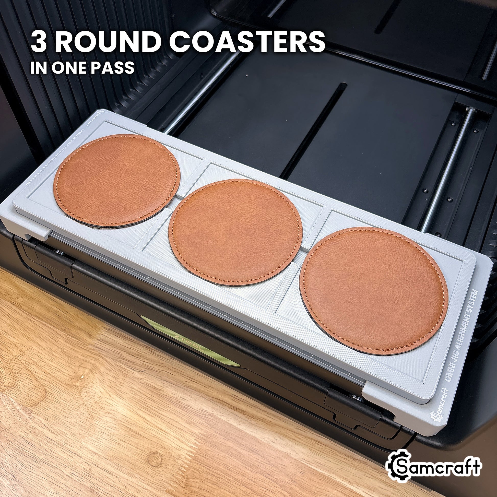 Three round 99mm coasters loaded in the Samcraft xTool Omni jig, three round coasters printed at a time.