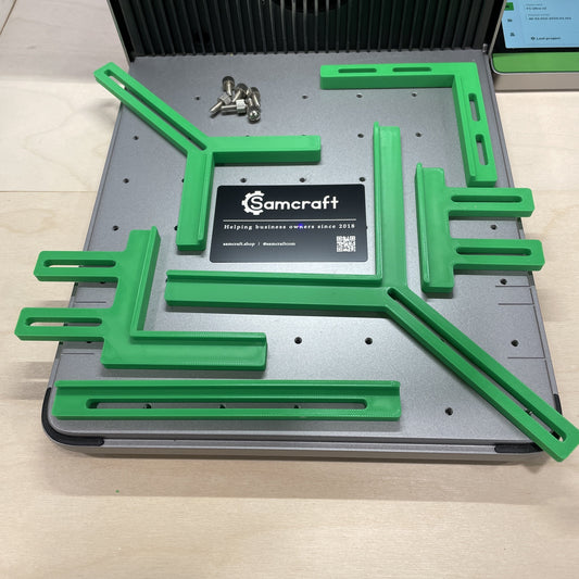 Samcraft green fence kit laid out on the xTool F1 Ultra bed, showing the full set of rails and corner brackets.