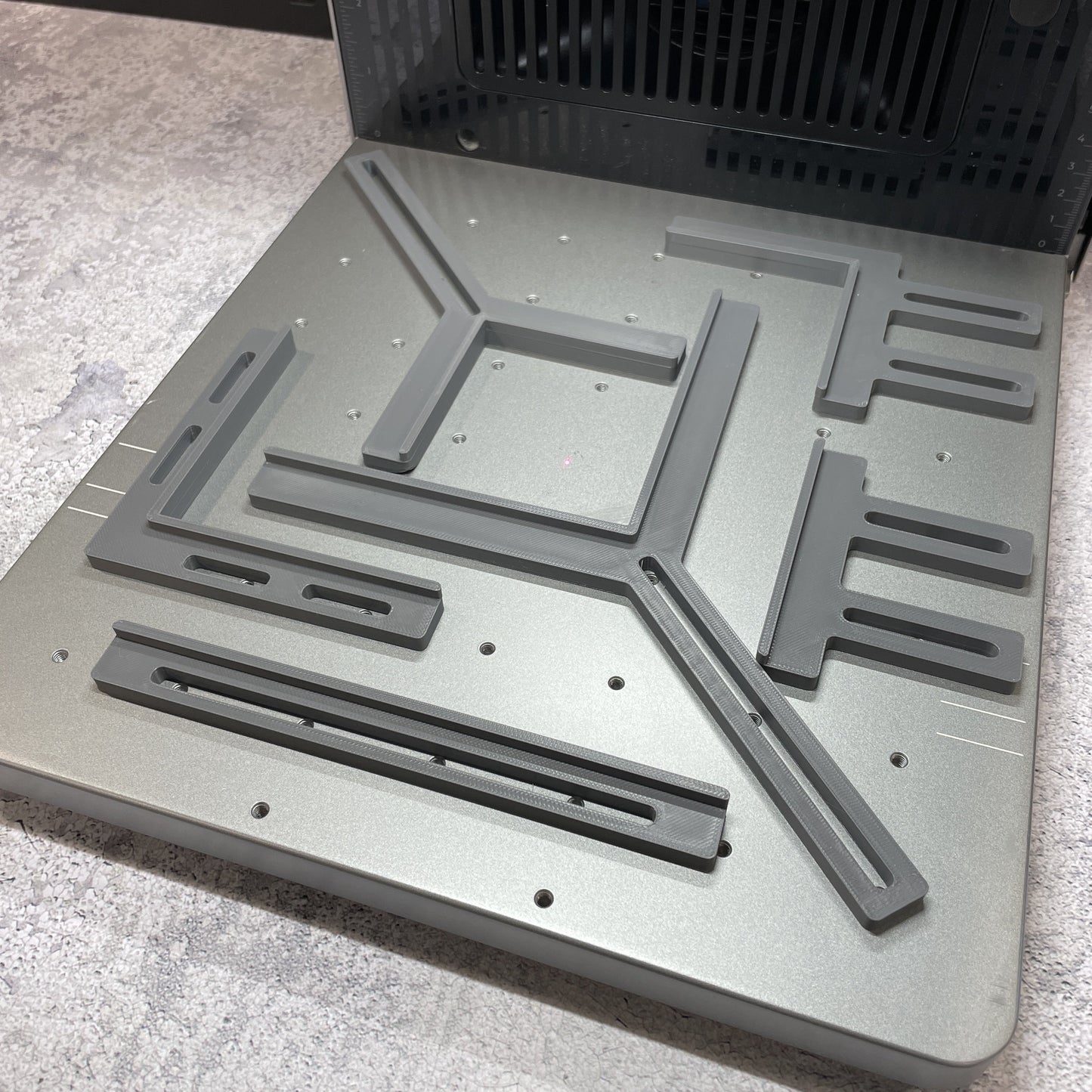 Samcraft fence kit laid out on the xTool F2 Ultra bed, showing the full set of rails and corner brackets.