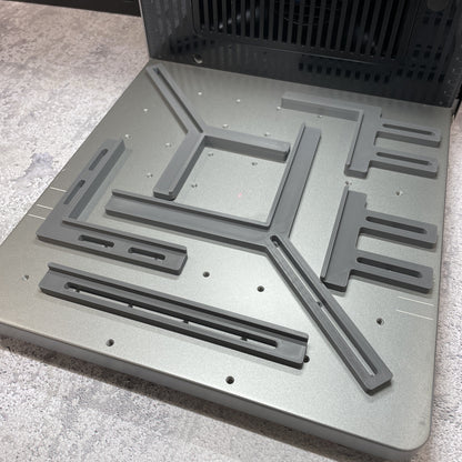 Samcraft fence kit laid out on the xTool F2 Ultra bed, showing the full set of rails and corner brackets.
