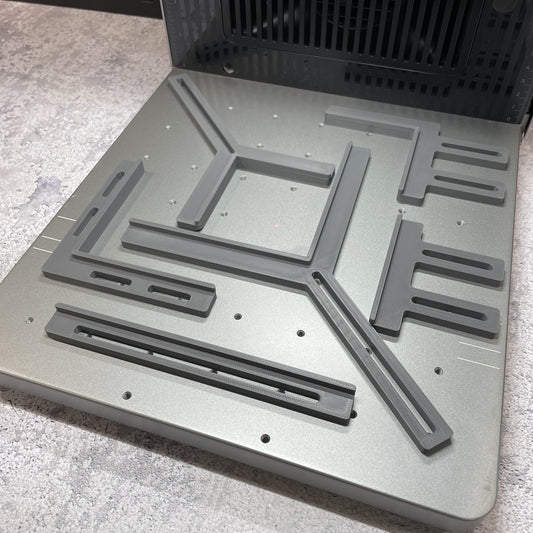 Samcraft fence kit laid out on the xTool F2 Ultra bed, showing the full set of rails and corner brackets.