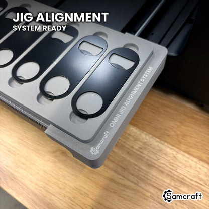 Samcraft opener jig seated on the optional Samcraft Omni Jig Alignment System, the alignment system lettering visible along the edge.